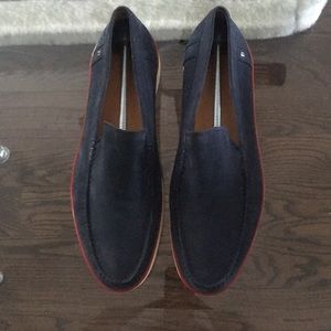 Bally blue suede shoes with a red trim.